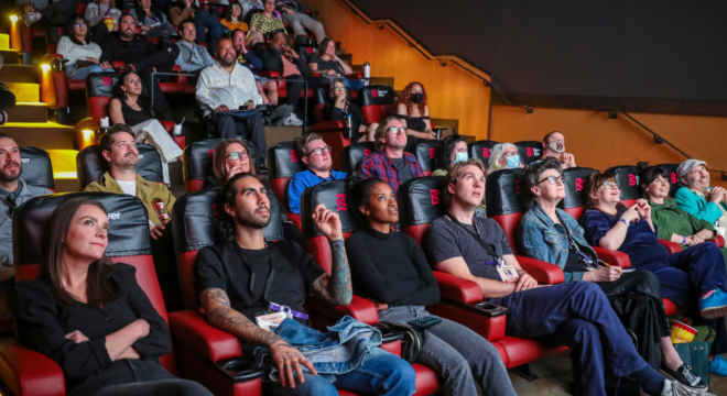 An audience in a movie theater watching Series Fest